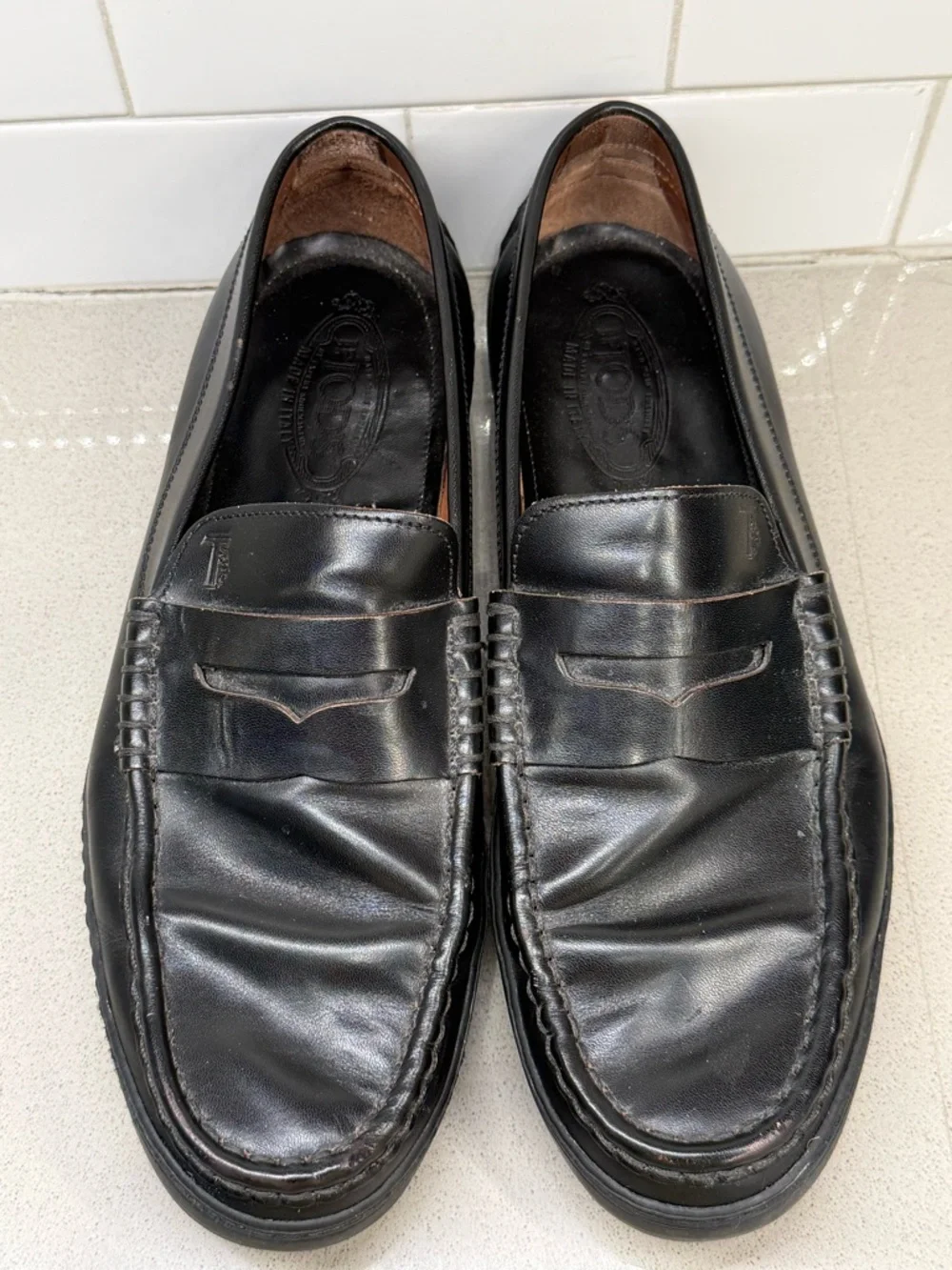 Tod's Black Leather Penny Loafers for Men